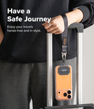 Holder Link Tactical Webbing Hand Strap - A black tactical wrist strap attached to a phone case hanging from a suitcase handle.