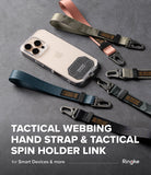 Holder Link Tactical Webbing Hand Strap - A smartphone with a tactical holder link and various colored webbing hand straps.