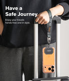 Holder Link Tactical Webbing Hand Strap - Camo wrist strap attached to a phone case hanging from a luggage handle.