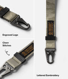 Holder Link Tactical Webbing Hand Strap - Olive webbing strap with black metal carabiner, branded tag, and stitching.