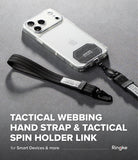 Holder Link Tactical Webbing Hand Strap - A clear smartphone case with a black tactical webbing hand strap and black spin holder link, shown on a gray surface with large text reading 'TACTICAL WEBBING HAND STRAP & TACTICAL SPIN HOLDER LINK' and the Ringke logo.