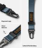 Holder Link Tactical Webbing Hand Strap - Blue tactical strap with metal carabiner, engraved logo, and embroidered label.