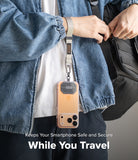 Holder Link Tactical Webbing Hand Strap - A beige tactical webbing strap attached to a smartphone, worn around the wrist.