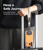 Holder Link Tactical Webbing Hand Strap - A beige tactical wrist strap attached to a phone case hanging from a suitcase.