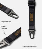 Holder Link Tactical Webbing Lanyard Strap - Black tactical strap with metal carabiner, engraved logo, and orange embroidery.