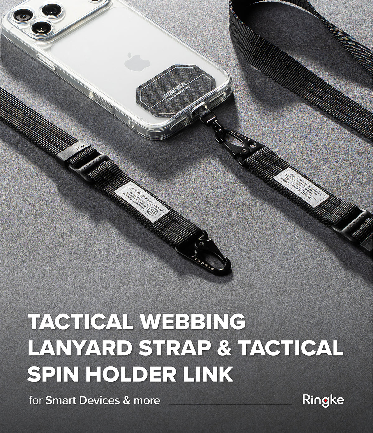 Holder Link Tactical Webbing Lanyard Strap - A tactical webbing lanyard strap with a black tactical spin holder link, shown attached to a smartphone case on a dark gray textured surface. The Ringke brand name is visible in the bottom right corner.
