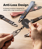 Holder Link Tactical Webbing Lanyard Strap - Close-up of a person holding a black carabiner attached to a webbing strap, with other straps and a text overlay reading 'Anti-Loss Design' on a light wood surface.