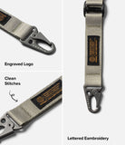 Holder Link Tactical Webbing Lanyard Strap - Beige tactical strap with metal carabiner, engraved logo, and branded patch.