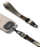 Holder Link Tactical Webbing Hand Strap - Gray tactical webbing strap with black metal carabiner attached to a phone.