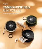Mini Pouch | Tambourine Bag - Three round mini pouches in beige, green, and black, with accessories on a tan background.