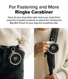 Mini Pouch | Tambourine Bag - A round pouch clipped to jeans and a bag strap using a carabiner to hold small accessories.
