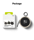 Mini Pouch | Tambourine Bag - A beige circular pouch with a carabiner and a branded patch next to its retail packaging.