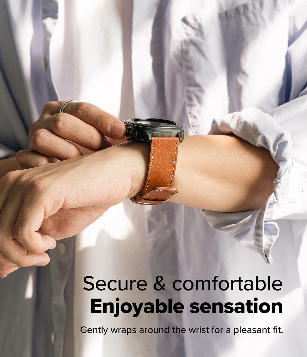 Watch Lug 24mm | Leather One Basic Bold - Person wearing a black smartwatch with a tan leather strap on their wrist.