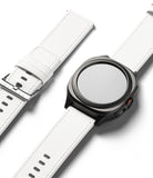 Watch Lug 24mm | Leather One Basic Bold - Black smartwatch with a white leather strap and a separate matching strap.