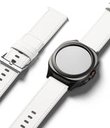 Watch Lug 24mm | Leather One Basic Bold - Black smartwatch with a white leather strap and a separate matching strap.