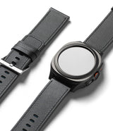 Watch Lug 24mm | Leather One Basic Bold - Black leather watch strap attached to a dark smartwatch with a round face.