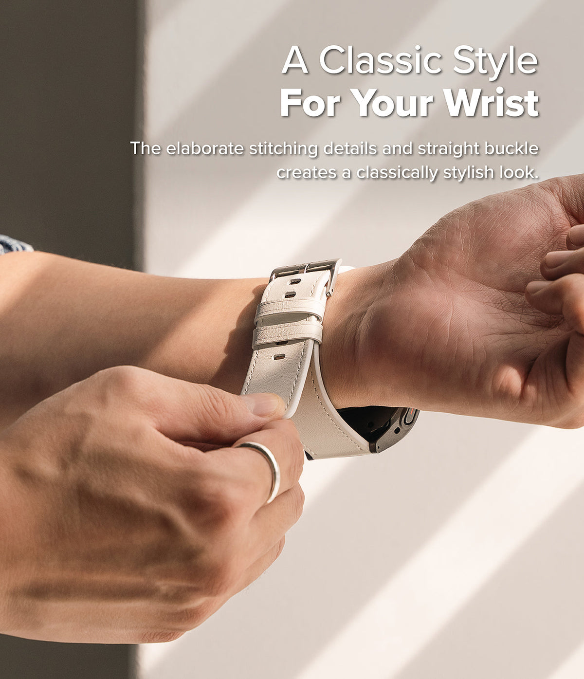 Watch Lug 24mm | Leather One Basic Bold - Close-up of hands fastening a white leather watch strap with a silver buckle.