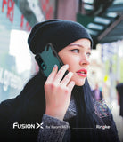 Mi 10 / 10 Pro Case | Fusion-X - Woman in a black beanie holding a Xiaomi Mi 10 with a black Fusion-X protective case.