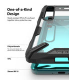 Mi 10 / 10 Pro Case | Fusion-X - Close-up of a clear protective phone case with black TPU edges on a teal Xiaomi Mi 10.