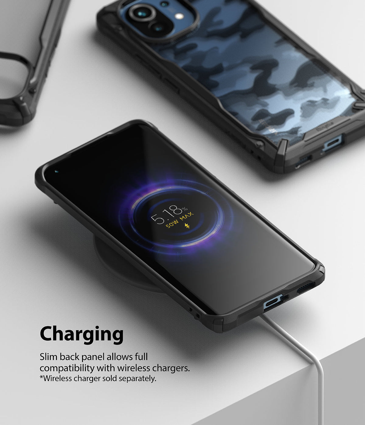 Mi 11 Case | Fusion-X - Mi 11 phone in a protective case wirelessly charging on a pad with a blue camo case visible nearby.