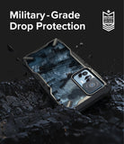 Xiaomi 12T / 12T Pro Case | Fusion-X - Rugged phone case with camo back resting on dark, textured debris with military-grade protection text.