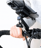Quick & Go | Bike Mount Vibration Damper Add-on - A hand attaches a vibration damper module to a bike phone mount.