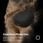 AirPods Pro Case - Black - Matte black protective case surrounded by a cloud of dust against a black background.