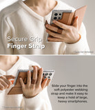 Galaxy S25 Ultra Cover | Folio Grip Wallet Magnetic - Person holding a phone in a brown folio case with a finger strap.