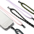 Holder Link Strap | Clear - A clear phone case with Handle With Care text next to several colorful, reflective rope lanyards.