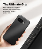 Google Pixel 9a Case | Onyx Magnetic - Hand holding a black phone case with a textured micro-dot grip pattern on the side.