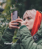 iPhone 11 Case | Fusion Matte - Person with pink hair in a green jacket taking a photo with a matte black iPhone 11 case.