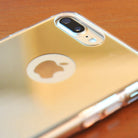 iPhone 7 Case | Mirror - A gold reflective mirror phone case on an iPhone 7, showing the camera cutout and Apple logo.