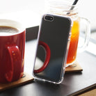 iPhone SE / 5s / 5 Case | Mirror - Reflective phone case standing between a red coffee mug and a glass of iced tea.