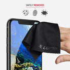 Microfiber Cleaning Cloth [Small] - Hand wiping a smartphone screen with a black Lupin microfiber cloth to remove dust and prints.