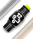 Apple Watch 42·41·40·38 mm | Sports Air Loop - Apple Watch with black patterned strap and neon tab, flanked by two neutral-colored fabric bands.