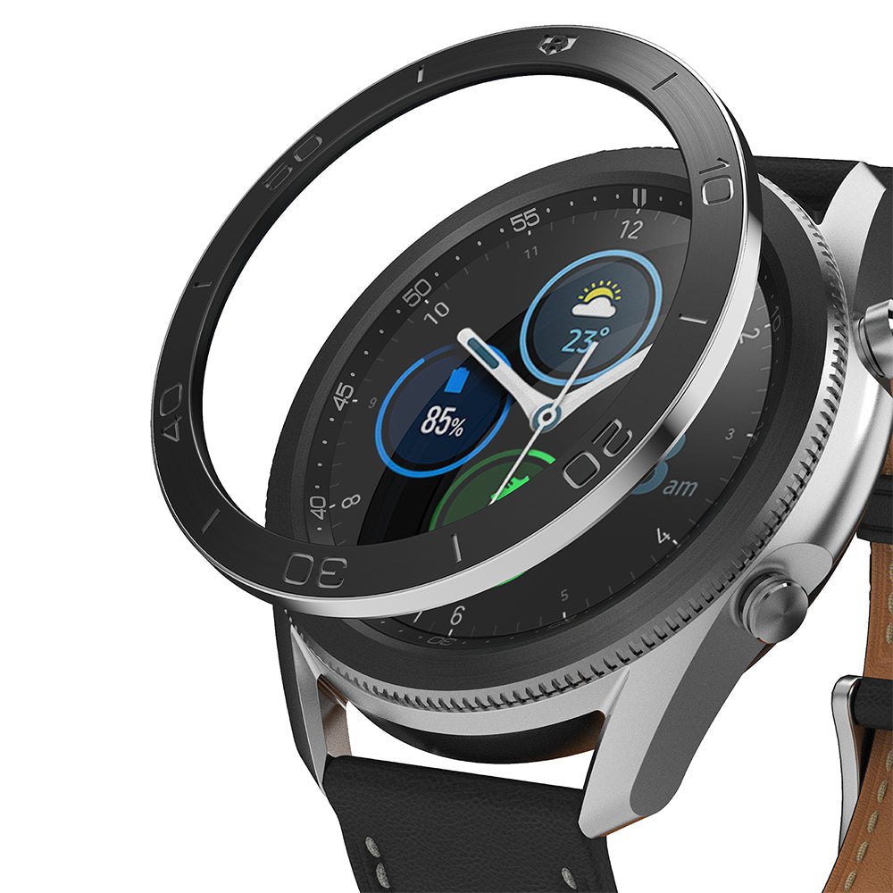 Galaxy Watch 3 (45mm) | Bezel Styling - A black metal adhesive bezel ring hovering above a silver Galaxy Watch 3.