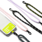 Holder Link Strap | Tarpaulin Neon Green - Neon green phone case with Handle With Care label attached to various colorful rope lanyards.