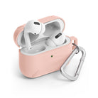 AirPods Pro Case - Peach Pink - Open peach pink silicone case holding white AirPods Pro with a silver carabiner attached.