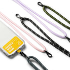 Holder Link Strap | Tarpaulin Yellow - Phone case with yellow Handle With Care label and various colorful rope lanyards.
