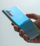 Galaxy Note 10 Case | Air - Clear (Dot) - Hand holding a blue iridescent Galaxy Note 10 in a clear, dotted protective case.
