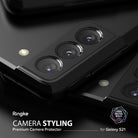 Galaxy S21 | Camera Styling - Close-up of a black smartphone camera module featuring a protective metal cover with lens cutouts.