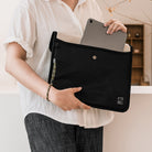 Paracord Lanyard Wrist Strap [6 Pack] - Person holding a black laptop sleeve with a camo paracord wrist strap attached.