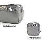 Travel Organizer Pouch - Grey medium and small zippered pouches with exterior pockets holding cash, earbuds, and a music player.