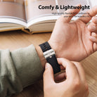 Galaxy Watch (46mm) | Rubber One Prime Band - Person adjusting a black ribbed rubber watch band with a metal clasp.