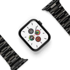 Apple Watch 49·46·45·44·42 mm | Metal One Band - Black metal link watch band detached from a black Apple Watch.