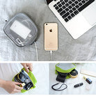 Travel Organizer Pouch - A mesh travel pouch holding tech accessories, shown with a smartphone, laptop, and cosmetics.