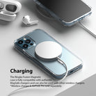 iPhone 12 / 12 Pro Case | Fusion Magnetic - iPhone 12 in a clear case charging wirelessly with a magnetic charger.