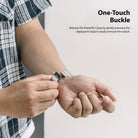 Watch Lug 22mm | Metal One Band α - Silver - Person releasing a silver metal watch band using a butterfly clasp.