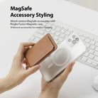 iPhone 12 / 12 Pro Case | Fusion Magnetic - Hands holding a clear iPhone case with a magnetic ring and a brown leather wallet.
