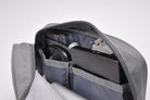 Travel Organizer Pouch - Open gray zippered case containing a computer mouse, external hard drive, SD card, and USB cables.